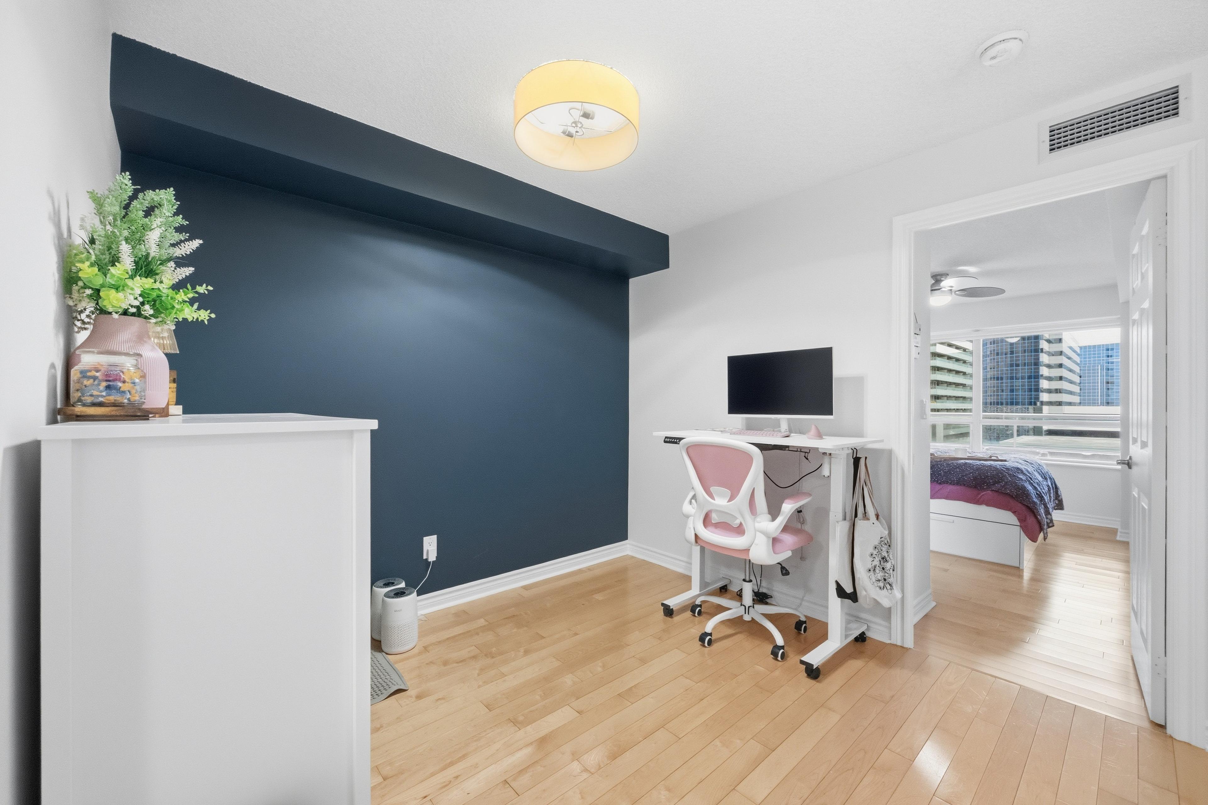 Den looking toward primary bedroom