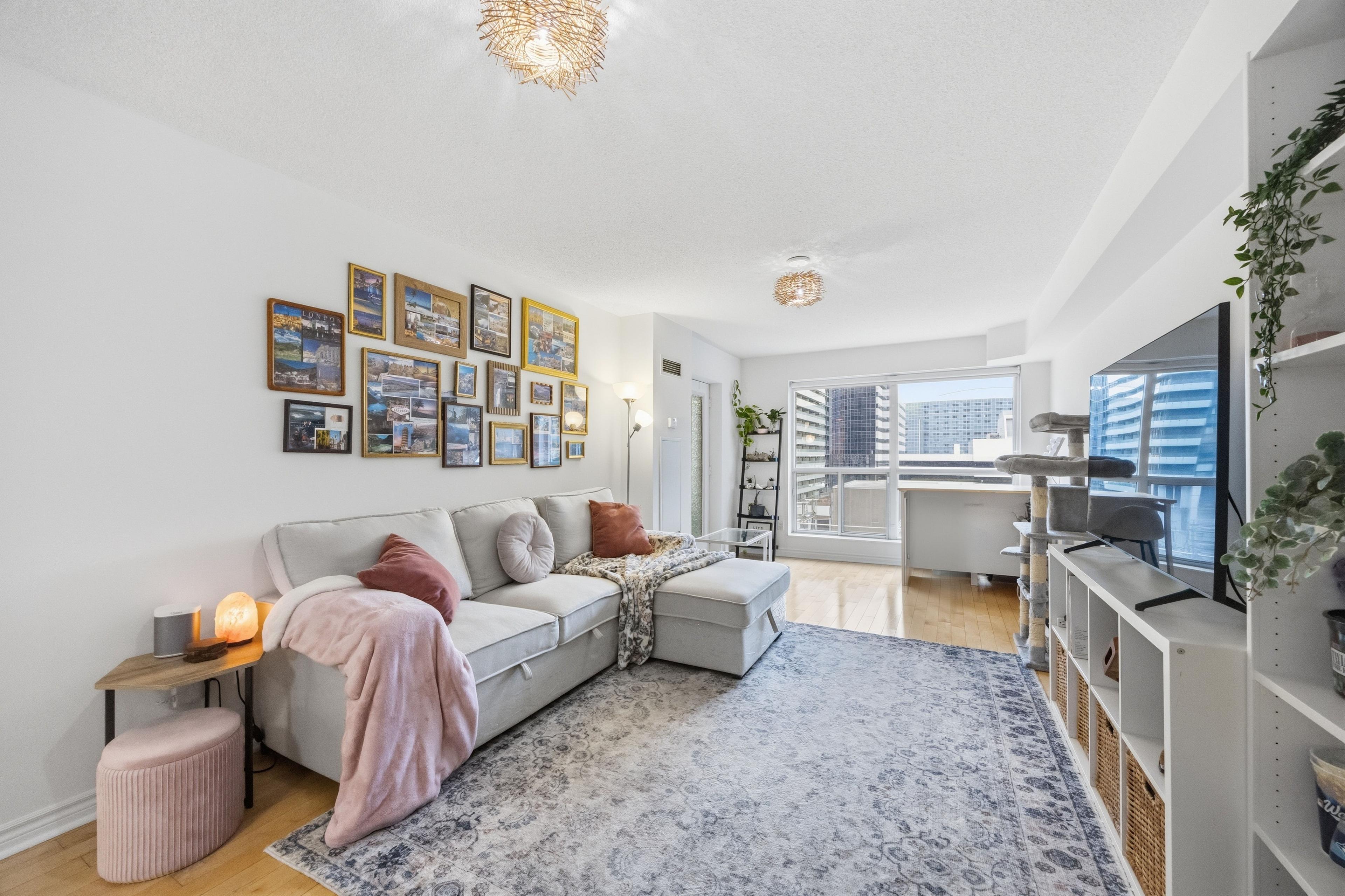 Living room with sectional sofa and balcony access