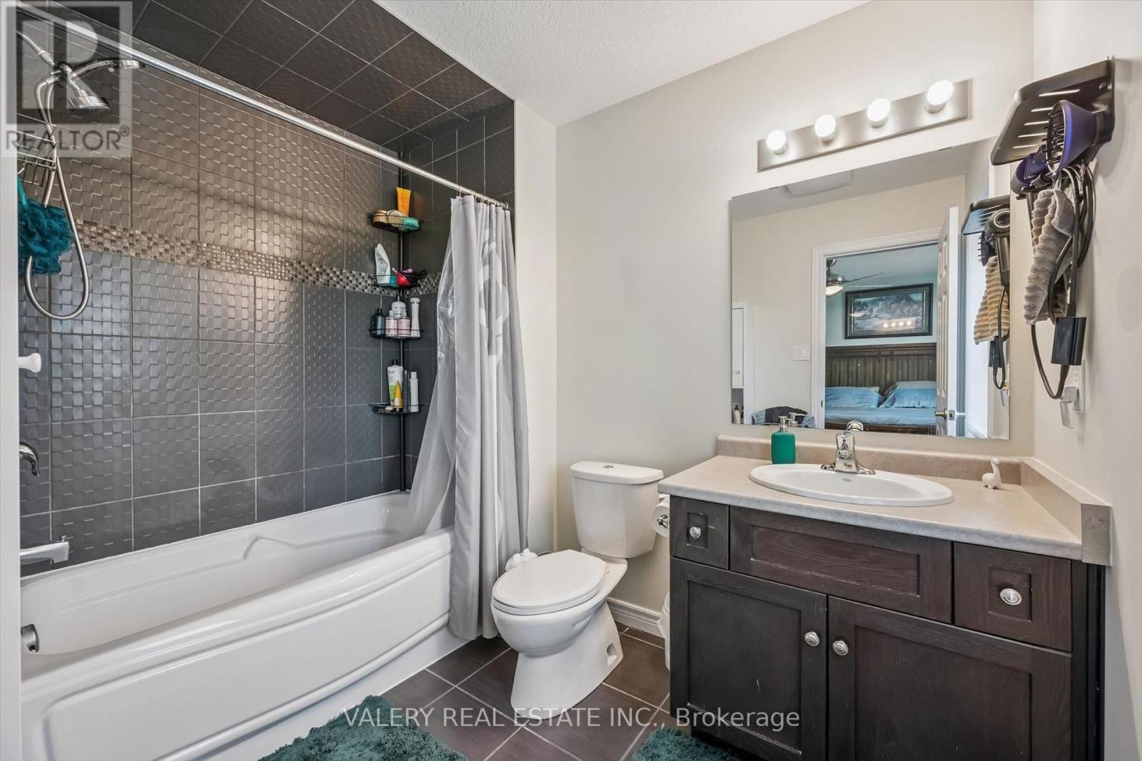 Primary ensuite with tub and tiled shower