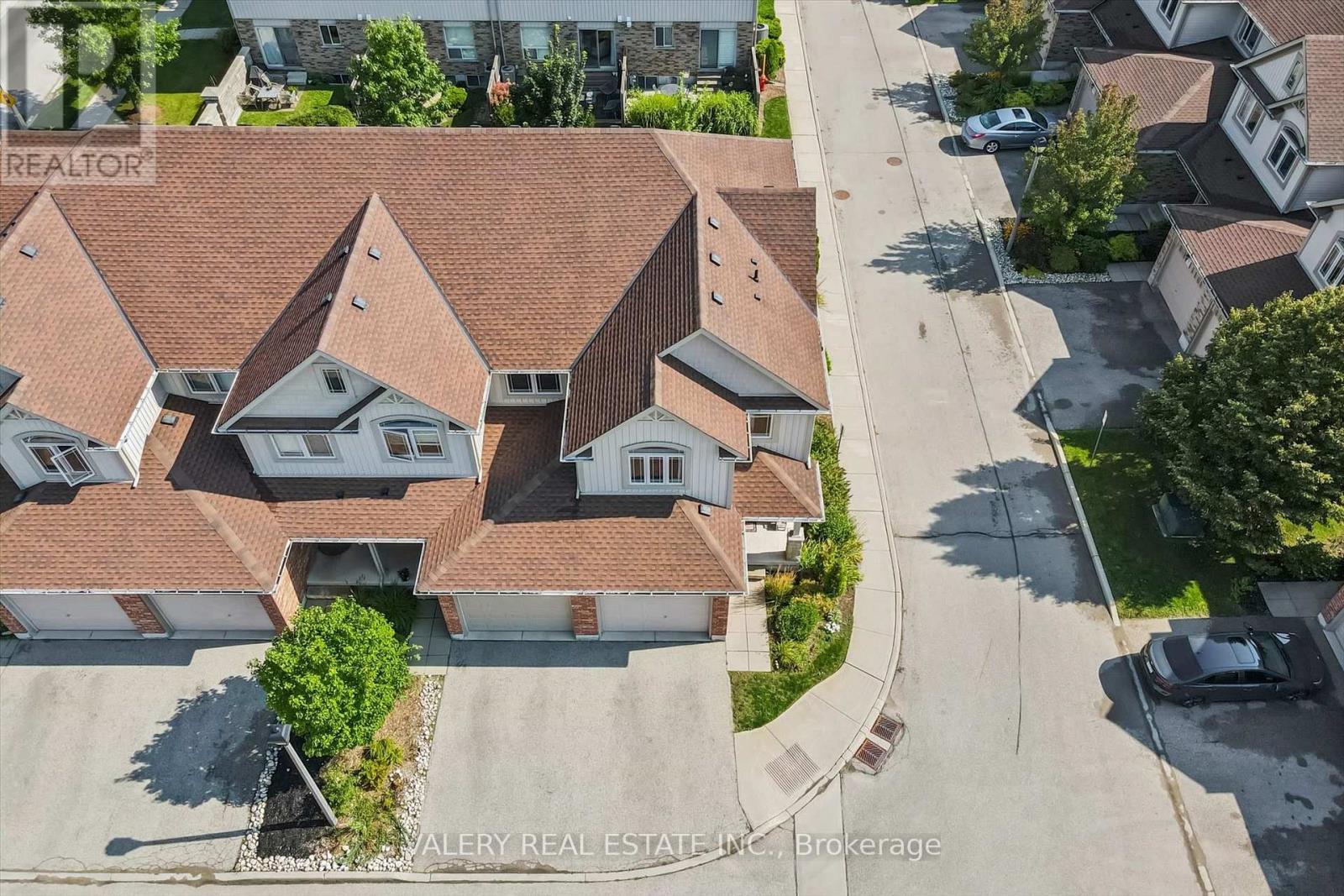 Aerial view of the townhome and quiet Kortright East street