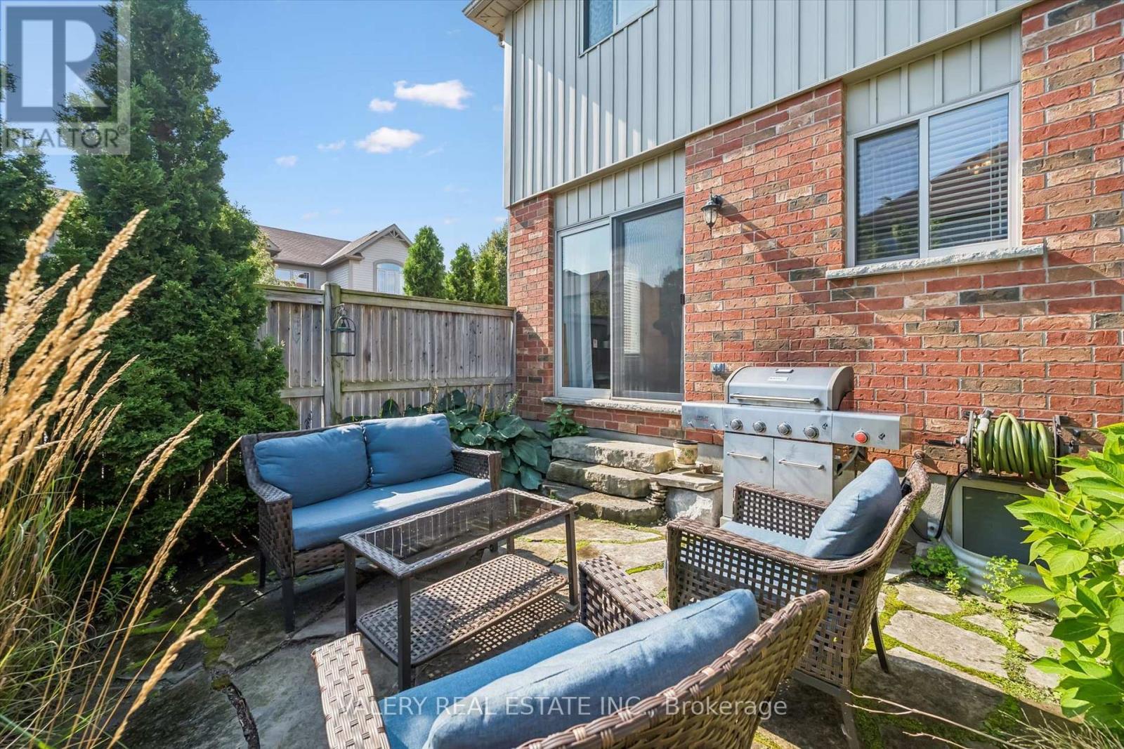 Rear yard seating area with landscaping