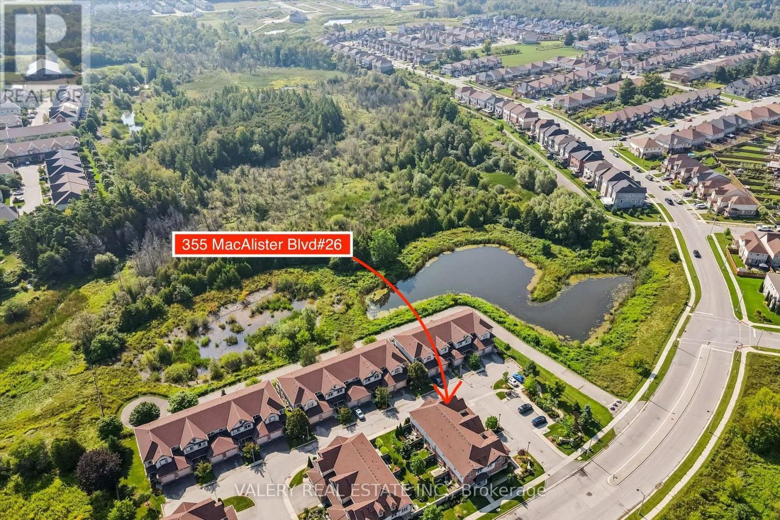 Aerial showing the home's location near the pond