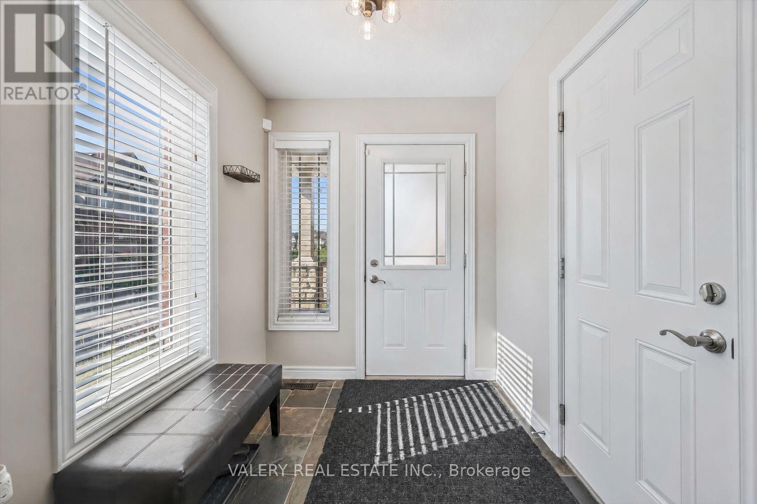 Front foyer with double-door closet and tiled entry