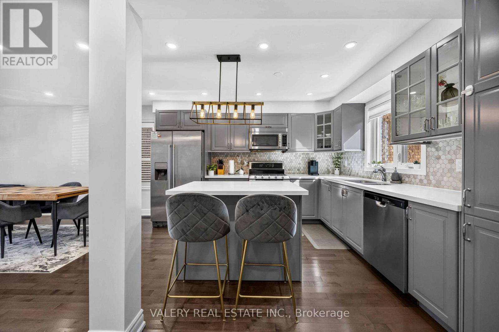 Kitchen island with bar seating and pendant lighting