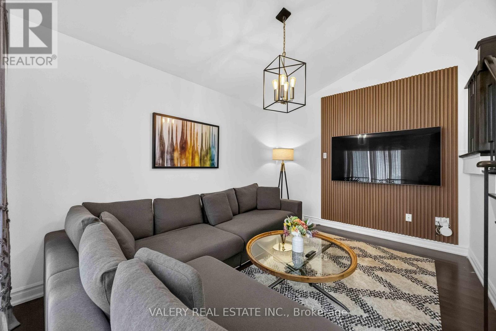 Vaulted family room with feature wall and sectional