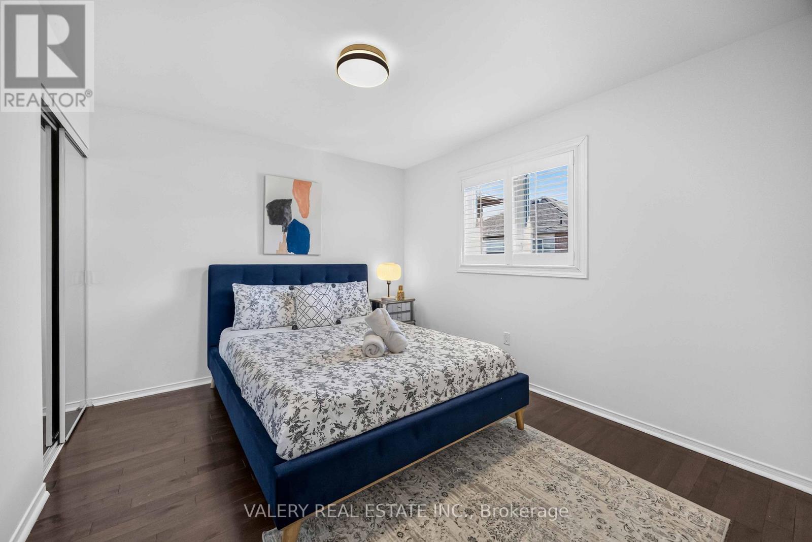 Bedroom, staged with blue bed