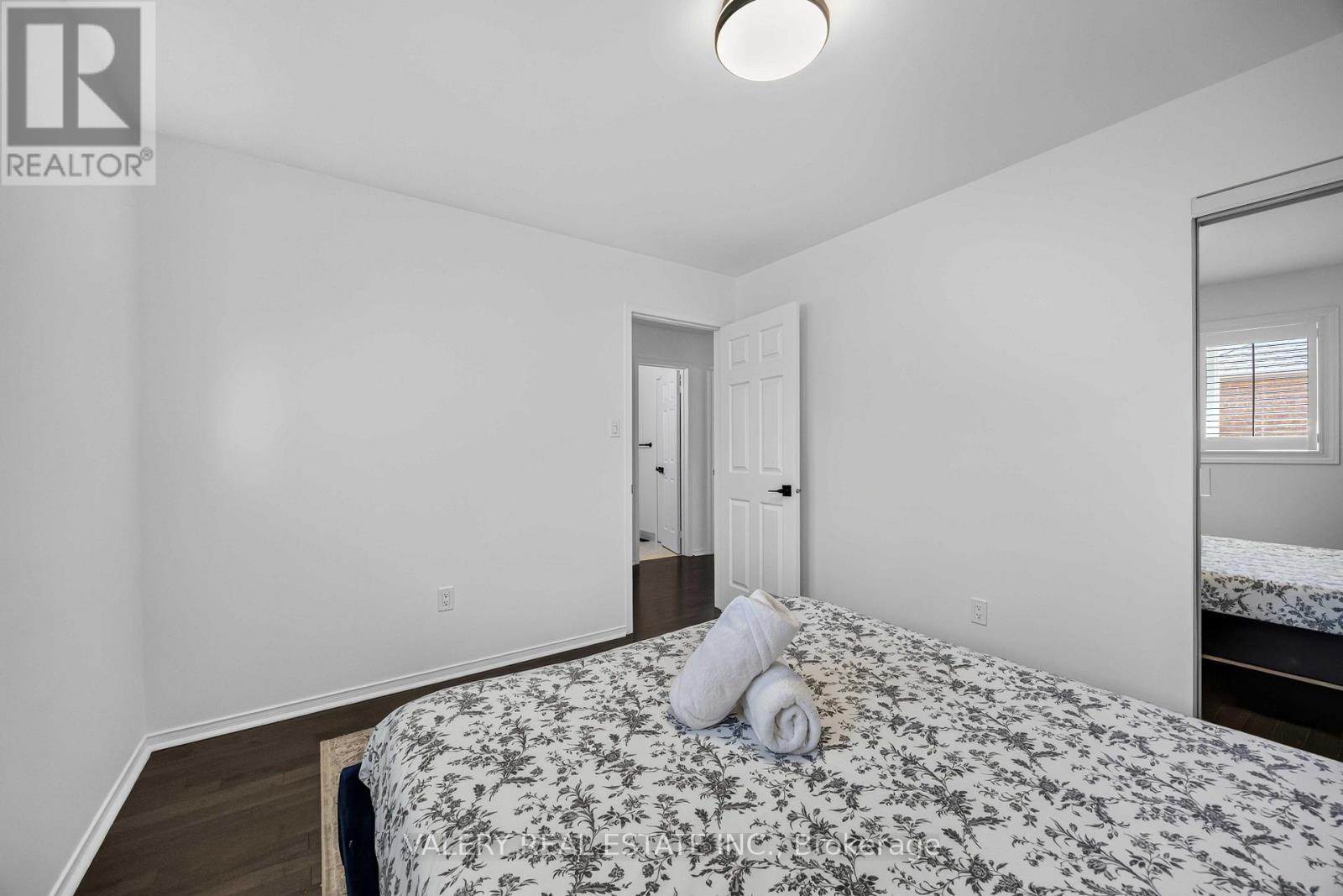 Bedroom with hardwood flooring