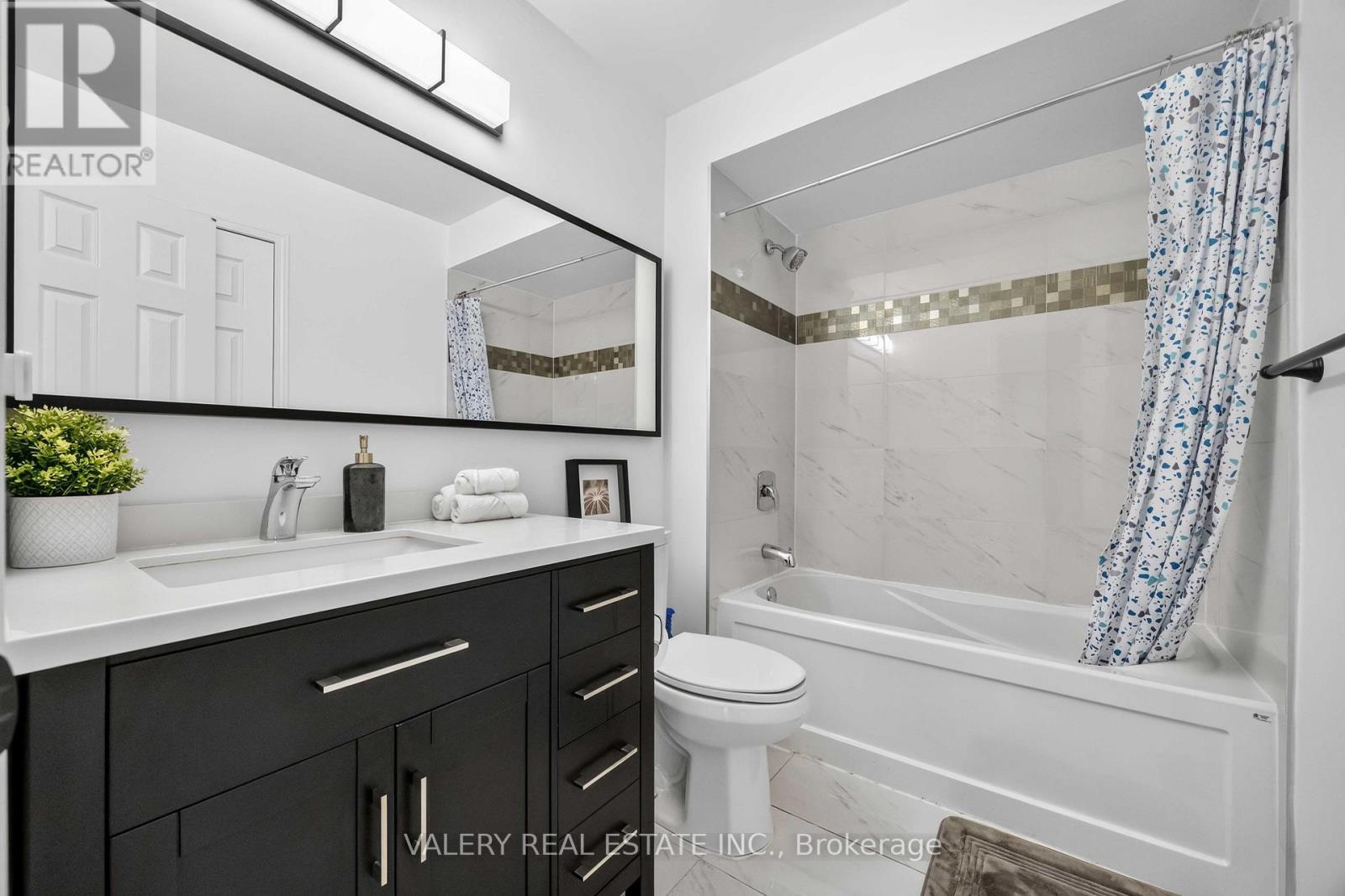 Four-piece bathroom with tub and shower