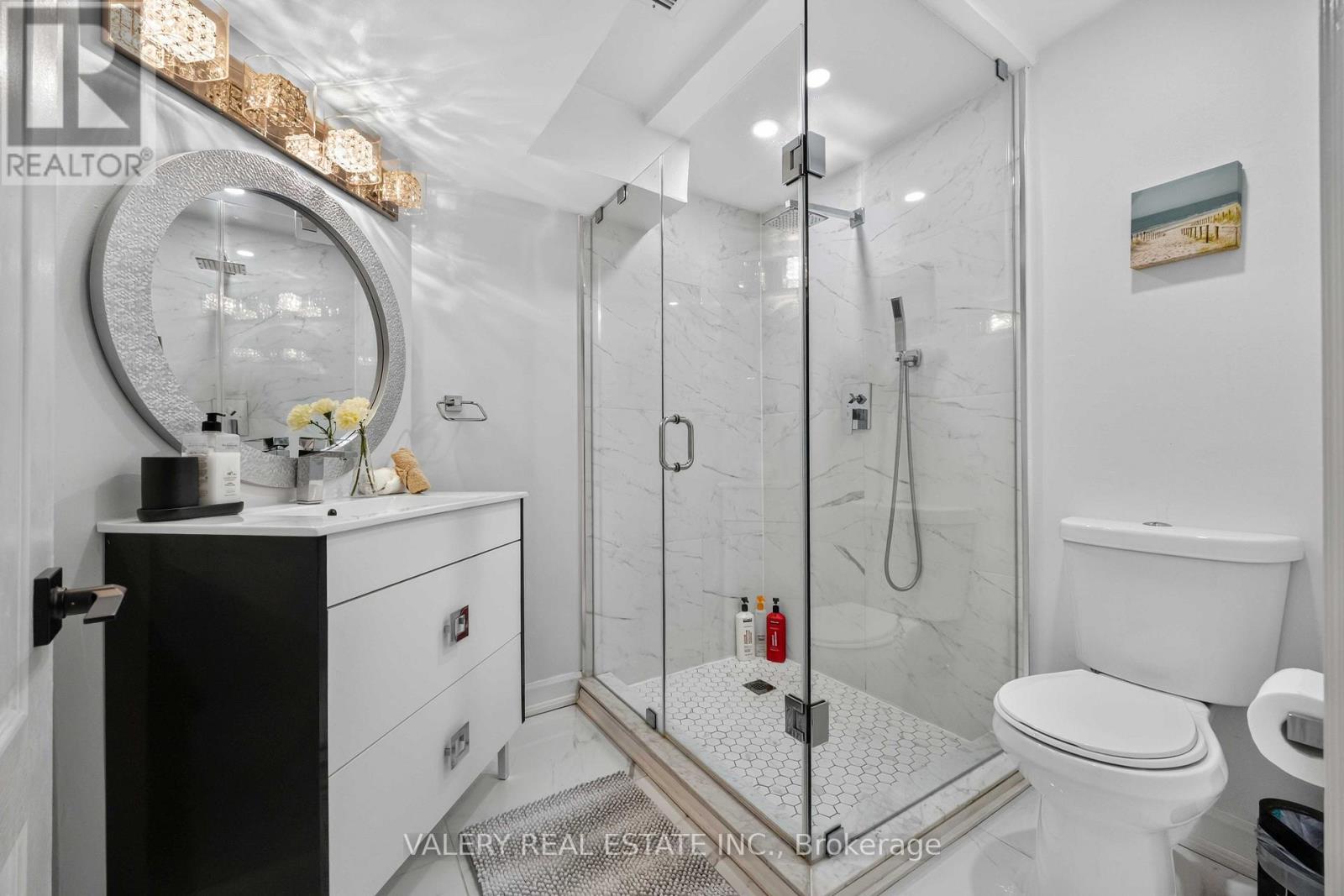 Basement three-piece bathroom with glass shower