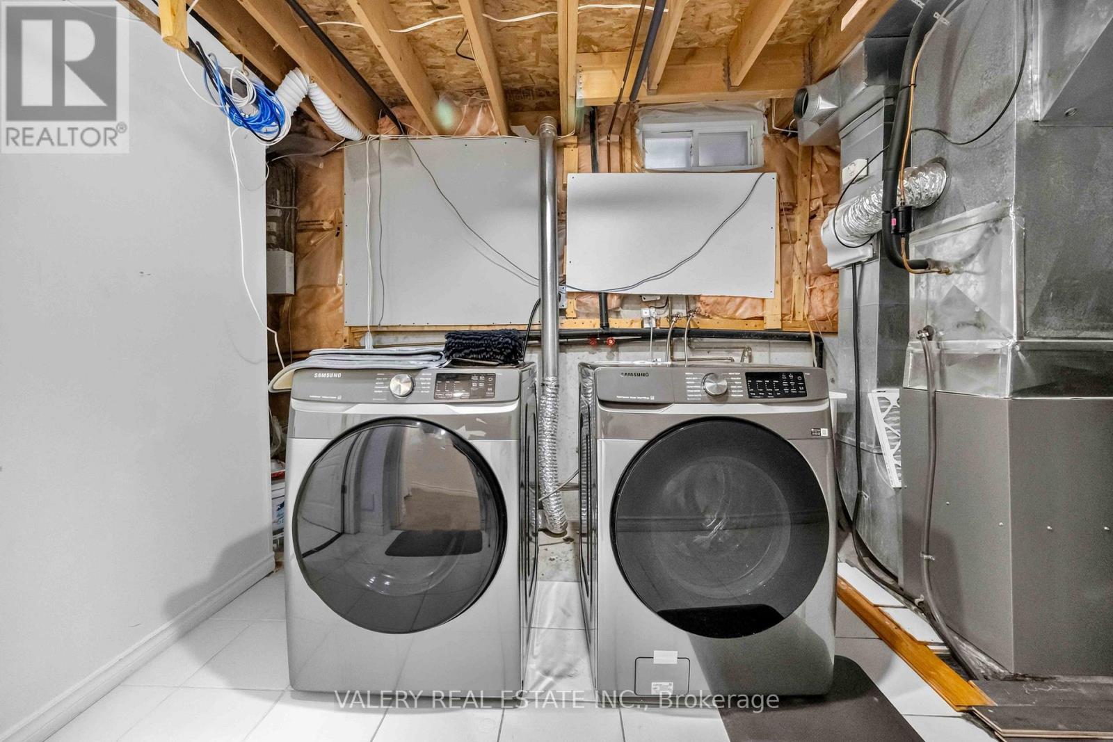 Laundry and utility area with washer and dryer