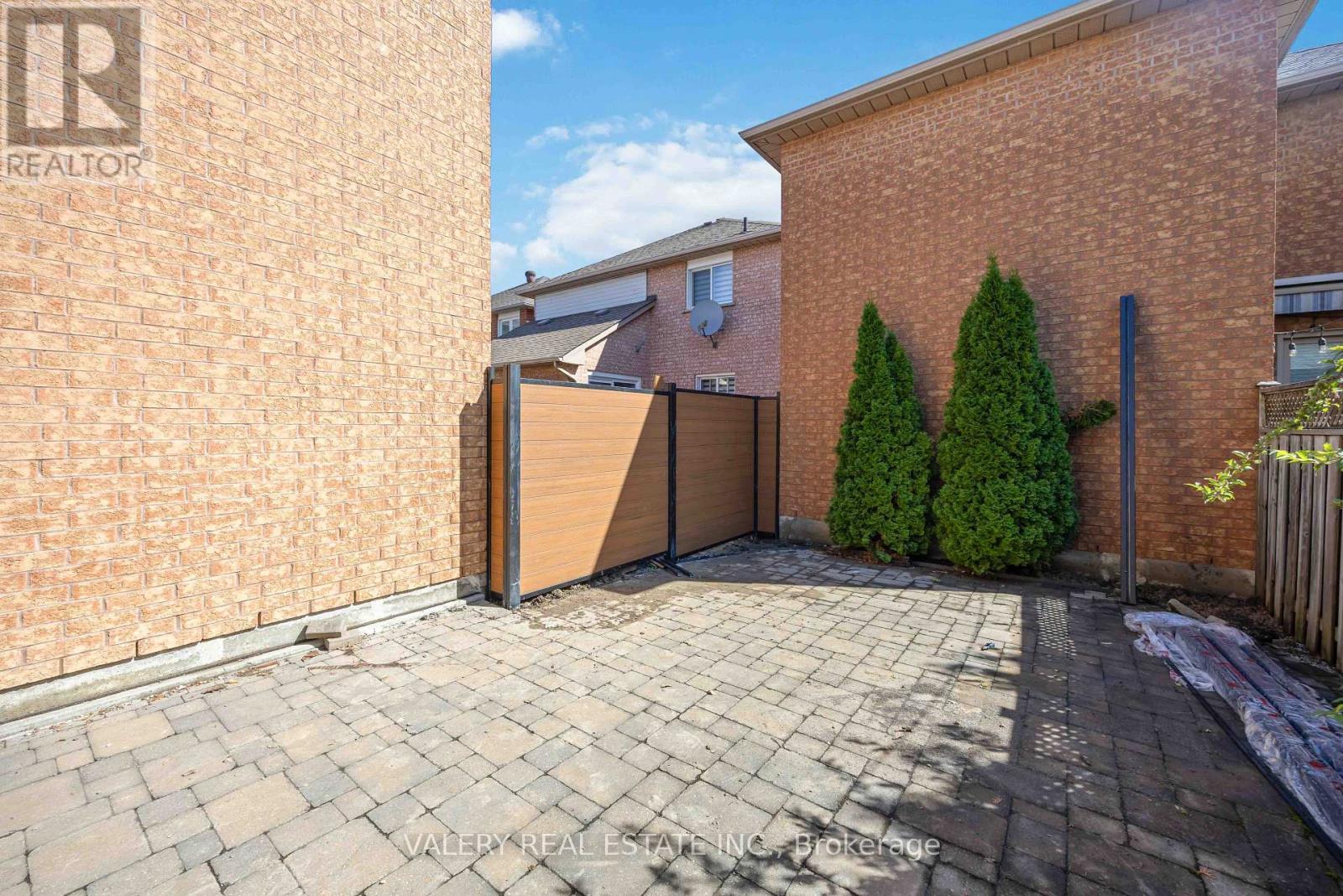 Interlock walkway along the side of the home