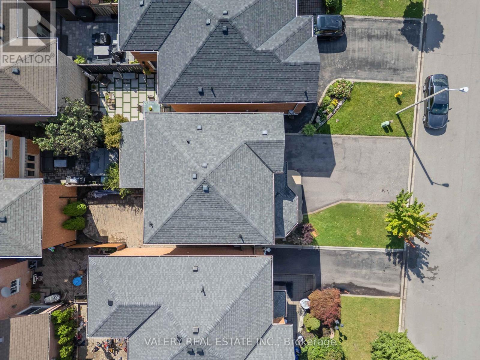 Top-down aerial of the roof and backyard
